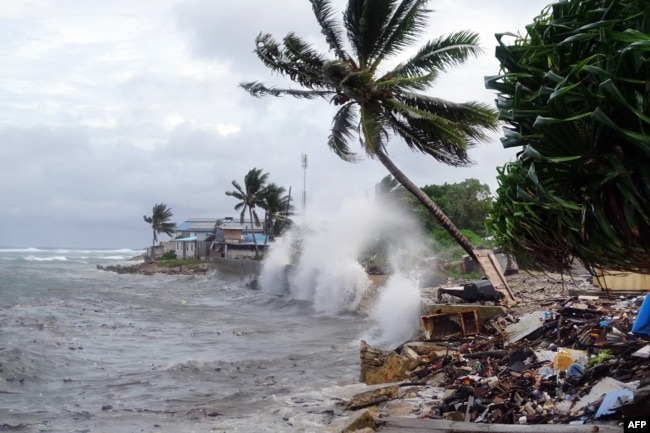 FILE - This picture taken on November 27, 2019 shows waves hitting the shore in Majuro, the capital city of the Marshall Islands. (Photo by Hilary HOSIA / AFP)