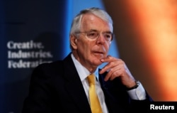 FILE - Britain's former Prime Minister John Major gives a speech on Brexit in London, Feb. 28, 2018.