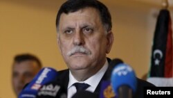 FILE - Libyan prime minister-designate under a proposed national unity government, Fayez Saraj, attends a news conference in Tunis, Tunisia, Jan. 8, 2016. 