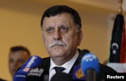 FILE - Libyan prime minister-designate under a proposed national unity government, Fayez Seraj, attends a news conference in Tunis, Tunisia, Jan. 8, 2016.