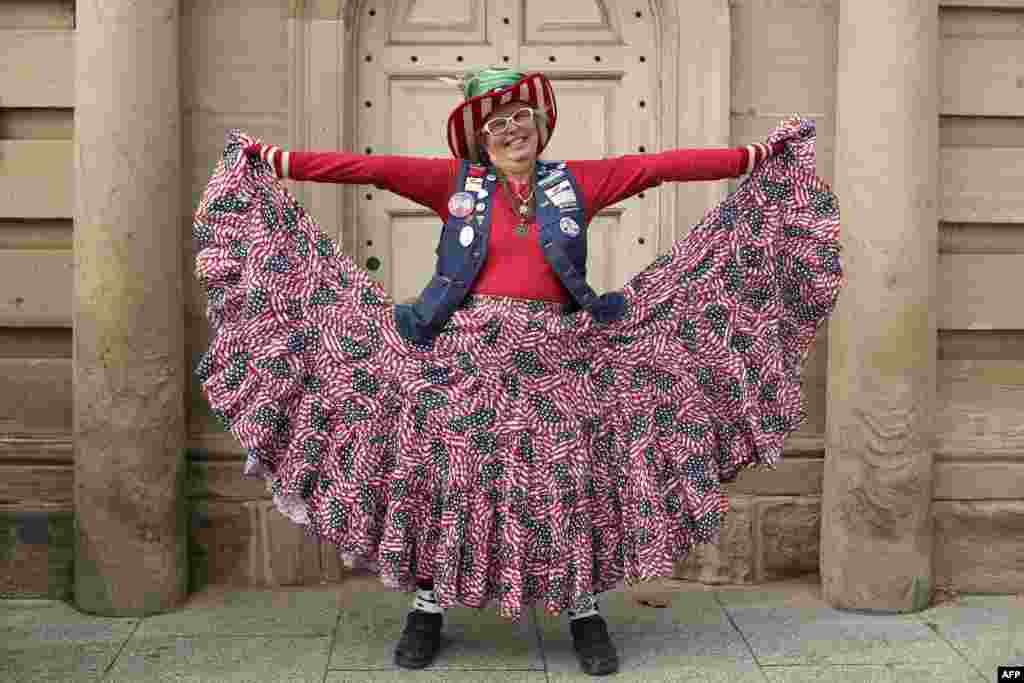 Susan Reneau poses for a portrait as she shows off her patriotic outfit near Constitution Avenue in Washington, DC.