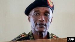 FILE - Uganda's former police chief Kale Kayihura appears at the military court in Kampala, Uganda, Aug. 24, 2018.