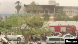 The site of suicide attack on Libyan electoral commission is seen in Tripoli, Libya, May 2, 2018 in this still picture obtained from social media video. (Al-Nabaa Channel/via Reuters)