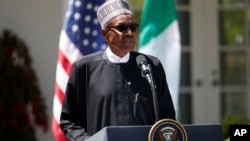 Nigerian President Muhammadu Buhari speaks during a news conference with President Donald Trump in the Rose Garden of the White House in Washington, April 30, 2018.