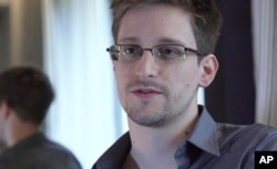 FILE - Edward Snowden, who worked as a contract employee at the National Security Agency, speaks to The Guardian newspaper in Hong Kong, June 9, 2013.