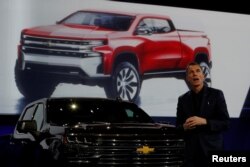 General Motors Global Design chief Michael Simcoe helps unveil new Chevy Silverado trucks at the North American International Auto Show in Detroit, Michigan, Jan. 13, 2018.