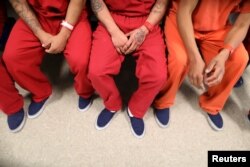 FILE - Immigration and Customs Enforcement detainees are seen at at a detention center in Adelanto, California, April 13, 2017.