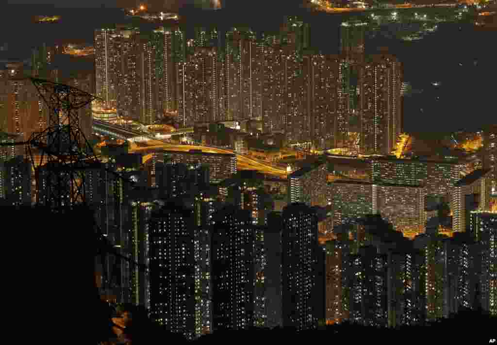 Tightly-packed buildings are seen from the Fei Ngo Shan in the night in Hong Kong, April 1, 2017.