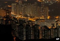 Tightly packed buildings are seen from the Fei Ngo Shan in the night in Hong Kong, April 1, 2017.
