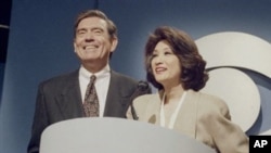 Dan Rather and Connie Chung share the podium at a news conference in New York, May 17, 1993 where it was announced Chung will join Rather as co-anchor of the "CBS Evening News."