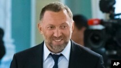 FILE - Russian metals magnate Oleg Deripaska attends a meeting in the Konstantin palace outside St. Petersburg, Russia, Aug. 9, 2016. 