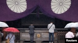 Visitors pray at the Yasukuni Shrine in Tokyo, Japan, Oct. 17, 2016.