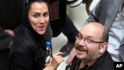  FILE - Jason Rezaian and his wife, Yeganeh Salehi, are shown at a political campaign event in Tehran, Iran, April 11, 2013.