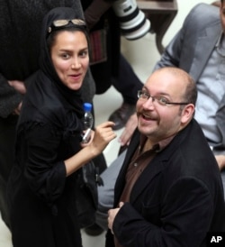 FILE - Jason Rezaian and his wife, Yeganeh Salehi, are shown at a political campaign event in Tehran, Iran, April 11, 2013.