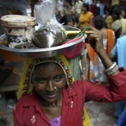 A woman sells henna at a Hindu festival in Jammu last year