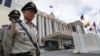 Cambodian police officers stand guard in front of the Peace Palace ahead of the ASEAN Summit and related meetings in Phnom Penh, Cambodia, November 17, 2012.