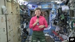 In this April 13, 2017, image from video made available by NASA, astronaut Peggy Whitson speaks during an interview aboard the International Space Station.