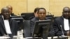 Former Kenyan Minister of Industrialization Henry Kiprono Kosgey, center, sits in the courtroom of the International Criminal Court (ICC) in The Hague, Netherlands, Sept. 1, 2011