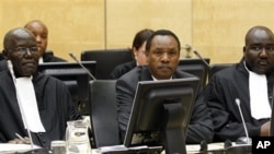 Former Kenyan Minister of Industrialization Henry Kiprono Kosgey, center, sits in the courtroom of the International Criminal Court (ICC) in The Hague, Netherlands, Sept. 1, 2011