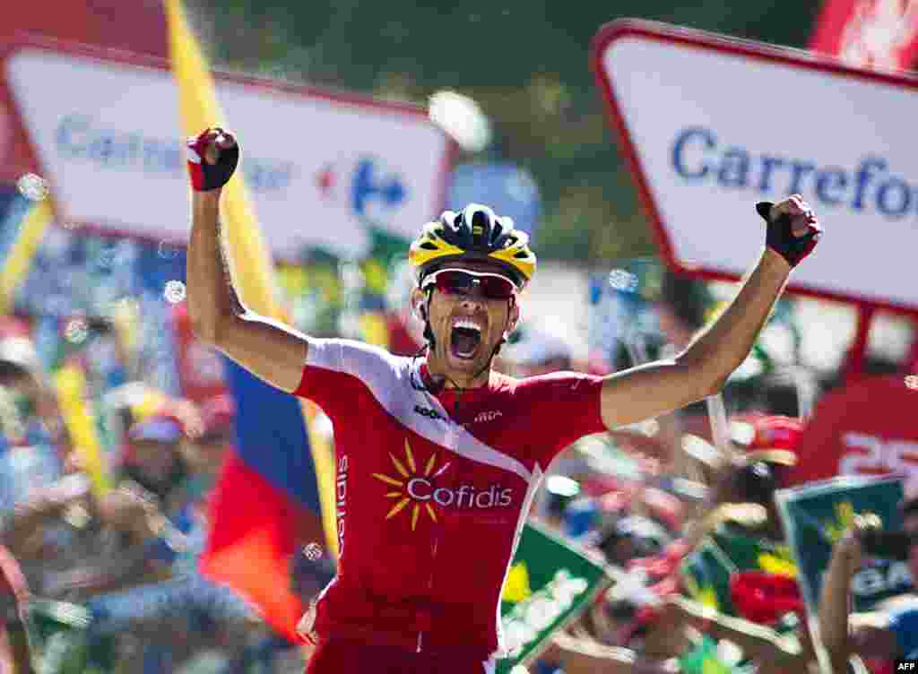 Cofidis&#39; Spanish cyclist Dani Navarro celebrates as he crosses the finish line to win the 13th stage of the 69th edition of &quot;La Vuelta&quot; Tour of Spain, a 188,7 km ride from Belorado to Obregon - Parque de Cabarceno.