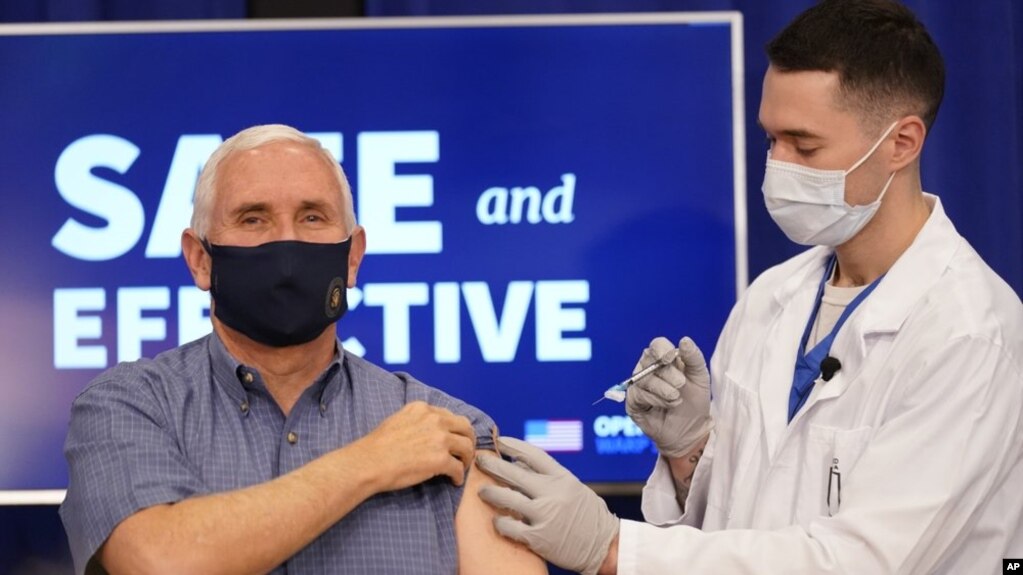 Vice President Mike Pence receives a Pfizer-BioNTech COVID-19 vaccine shot at the Eisenhower Executive Office Building on the White House complex, Friday, Dec. 18, 2020, in Washington. Karen Pence, and U.S. Surgeon General Jerome Adams also participated. 
