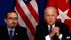 U.S. Vice President Joe Biden, right, accompanied by the U.S. Ambassador to Turkey John R. Bass, talks during a meeting with Turkish civil society groups on first day of his visit to Turkey, in Istanbul, Jan. 22, 2016. 