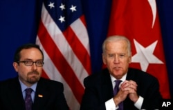 U.S. Vice President Joe Biden, right, accompanied by the U.S. Ambassador to Turkey John R. Bass, talks during a meeting with Turkish civil society groups on first day of his visit to Turkey, in Istanbul, Jan. 22, 2016.
