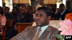 FILE - Teodorin Obiang Nguema, the son of Equatorial Guinea's president Teodoro Obiang Nguema sits during a mass at Malabo's Cathedral to celebrate his 41st birthday, June 25, 2013.