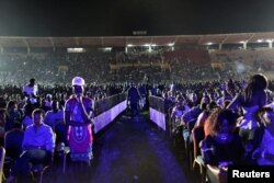 Fans of Nigerian pop star Wizkid wait for him to perform at a concert in Bamako, Mali, Nov. 15, 2015.