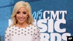 FILE - Ashley Monroe arrives at the CMT Music Awards in Nashville, Tennessee, June 10, 2015. 