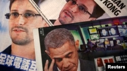 Photos of Edward Snowden, a contractor at the National Security Agency (NSA), and U.S. President Barack Obama are printed on the front pages of local English and Chinese newspapers in Hong Kong, June 11, 2013.