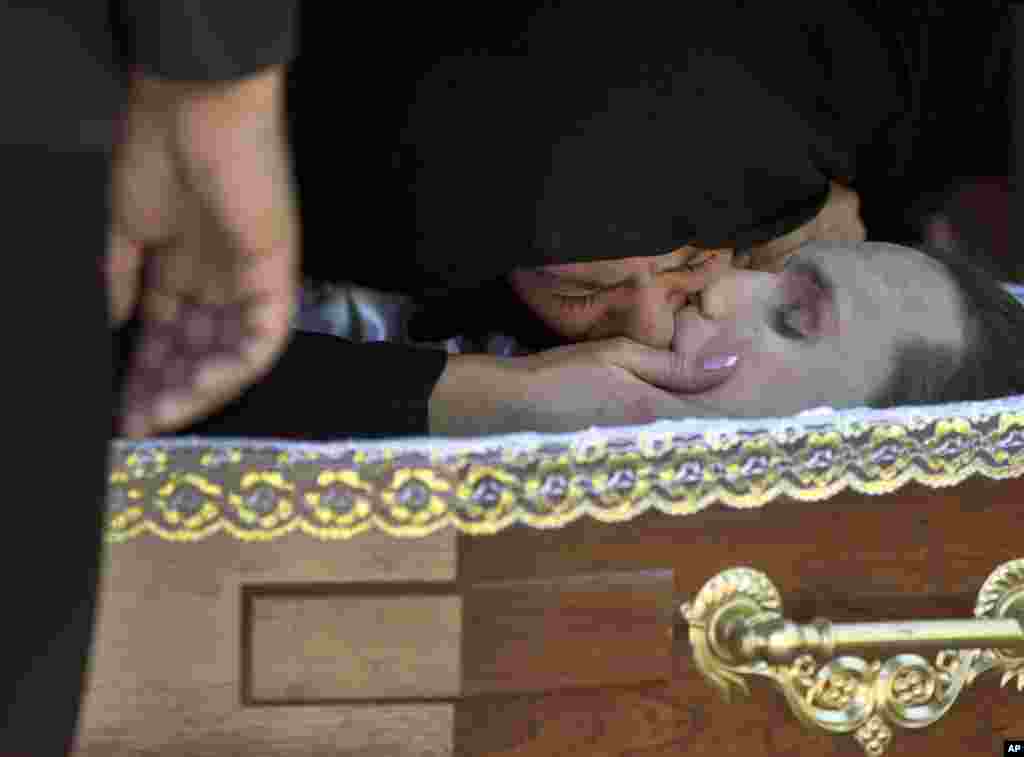 The girlfriend of Andrei Brazhevskiy, a pro-Russian activist, kisses him before the coffin is closed during the funeral in Odessa, Ukraine, Wednesday, May 7, 2014. Brazhevskiy, 27, died after jumping out of the burning trade union building in an attempt to escape Friday&#39;s fire that killed most of the 40 people that died after riots erupted last Friday. Girlfriend&#39;s name is not available. (AP Photo/Vadim Ghirda)