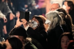 FILE - In this Feb. 27, 2020 file photo, spectators wear masks during the Isabel Marant fashion collection during Women's fashion week Fall/Winter 2020/21 presented in Paris. (AP Photo/Michel Euler, File)