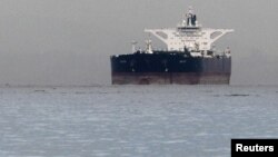 Malta-flagged Iranian crude oil supertanker "Delvar" is seen anchored off Singapore on March 1, 2012. Western trade sanctions against Iran are strangling its oil exports even before they go into effect.