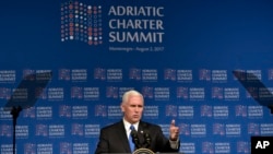 U.S. Vice President Mike Pence, gestures during the opening session of the Adriatic Charter Summit in Podgorica, Montenegro, Aug. 2, 2017. 