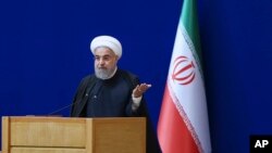 In this photo released by official website of the Iranian Presidency, President Hassan Rouhani speaks during a ceremony marking the country's nuclear energy national day, in Tehran, Iran, Apr. 7, 2016.