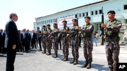 Le president Turque Recep Tayyip Erdogan, passe en revue les forces specials de police a Ankara, le 29 juillet 2016. (Kayhan Ozer Presidential Press Service, via AP, Pool)