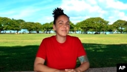 Ashley Maha'a sits in a park in Honolulu on June 22, 2021.