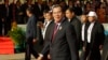 Cambodian Prime Minister Hun Sen, center, arrives for a ceremony of the 68th anniversary of the founding of his Cambodian People's Party in Phnom Penh, Cambodia, Friday, June 28, 2019. (AP Photo/Heng Sinith)