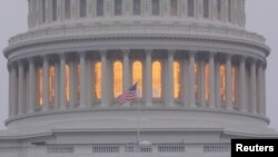 FILE - A United States flag flies in front of the U.S. Capitol dome in Washington, Nov. 6, 2018.