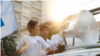 Srey Chamroeun (middle), a leader of a self-claim university students group, stands on the back of a pickup vehicle during a parade across Phnom Penh streets on Tuesday to submit a petition at CNRP&#39;s acting president, Kem Sokha&#39;s house. The petition demands Kem Sokha to explain the allegation of his sexual scandal. (Leng Len/VOA Khmer)