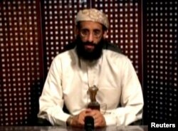 FILE - Anwar al-Awlaki, a U.S.-born cleric linked to al-Qaida's Yemen-based wing, gives a religious lecture in an unknown location in this still image taken from video released by Intelwire.com on Sept. 30, 2011.
