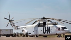 FILE - A United Nations helicopter offloads supplies at the airport in Malakal, South Sudan.