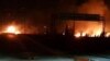 This photo released on May 9, 2018, by the Syrian official news agency SANA, shows flames rising after an attack in an area known to have numerous Syrian army military bases, in Kisweh, south of Damascus, Syria.