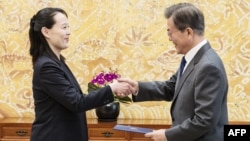 North Korean leader Kim Jong Un's sister Kim Yo Jong hands a signed letter from Kim Jong Un to South Korea's President Moon Jae-in during their meeting at the presidential Blue House in Seoul, Feb. 10, 2018.