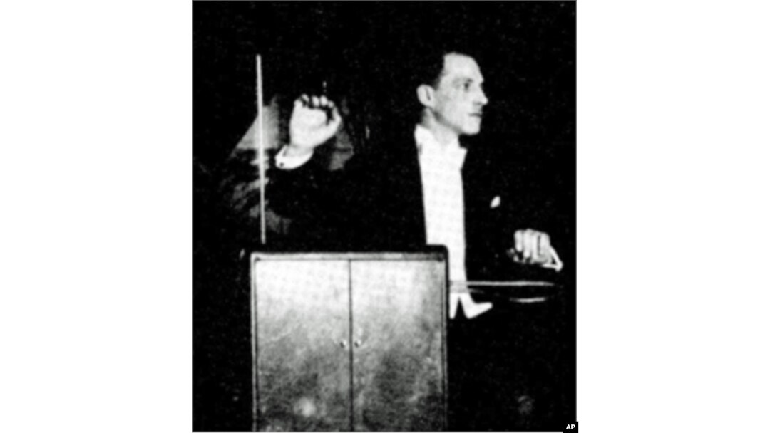 Inventor Leon Theremin playing his instrument in concert, c. 1924.