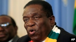 Zimbabwean President Emmerson Mnangagwa addresses a press conference in Harare ,Friday, Aug, 3, 2018. Zimbabwe's president says people are free to approach the courts if they have issues with the results of Monday's election, which he carried with just over 50 percent of the vote. President Emmerson Mnangagwa spoke to journalists shortly after opposition leader Nelson Chamisa called the election results manipulated and said they would be challenged in court. (AP Photo/Tsvangirayi Mukwazhi)