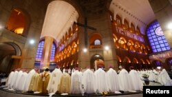 Priests take part in a mass held by Pope Francis in the Basilica of the Madonna of Aparecida, in Aparecida do Norte, Sao Paulo State, July 24, 2013.