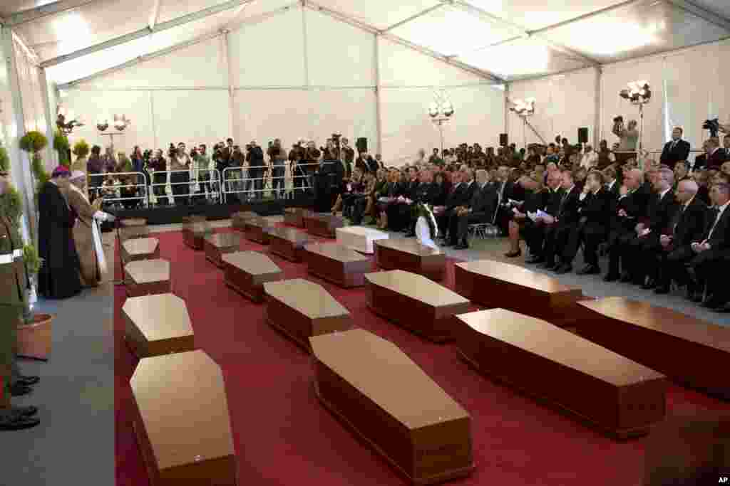 The funeral service for some of the migrants who drowned while trying to reach the southern coast of Italy, on the outskirts of Valletta, Malta, April 23, 2015.