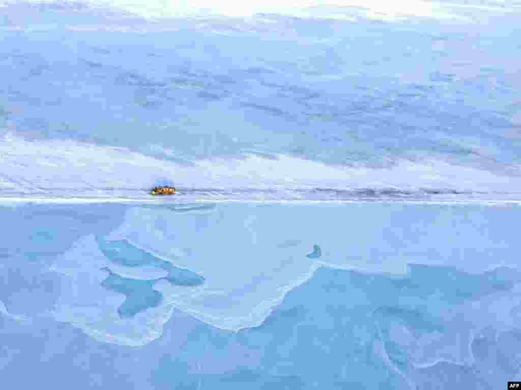 A truck drives down the frozen Dalton Highway north of Fairbanks, Alaska, USA, April 8, 2015. (photo released by the Alaska Department of Transportation &amp; Public Facilities)